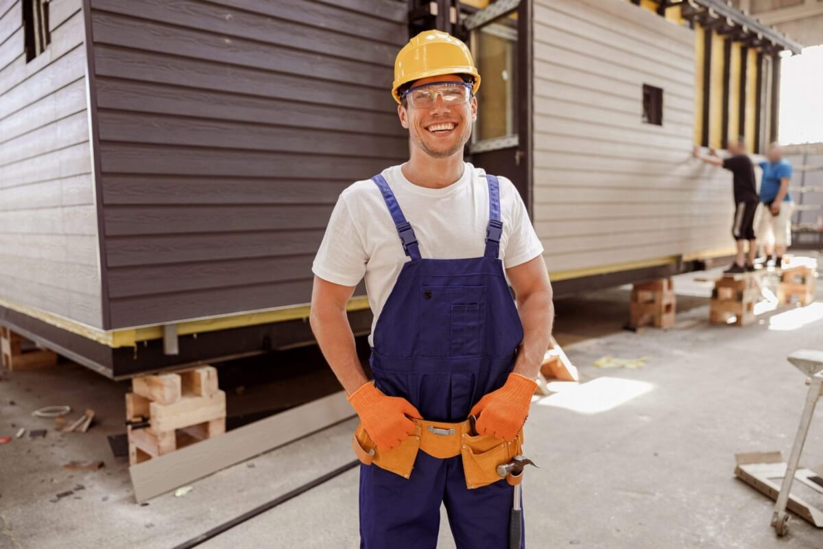 /assets/content/2022/09/cheerful-male-builder-standing-at-construction-sit-2022-01-19-00-13-05-utc-scaled.jpg